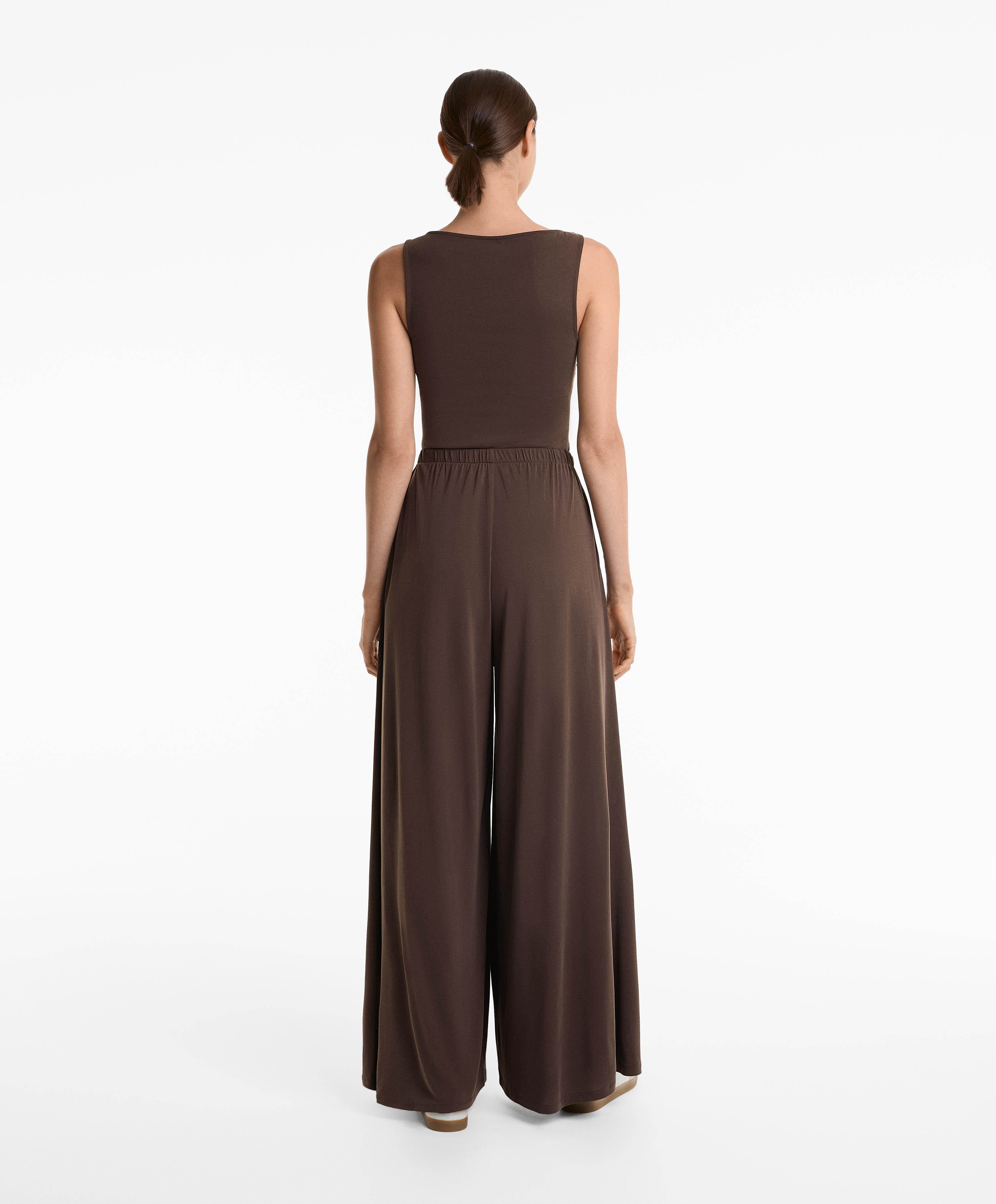 FLOATY CROSSOVER JUMPSUIT WITH MODAL