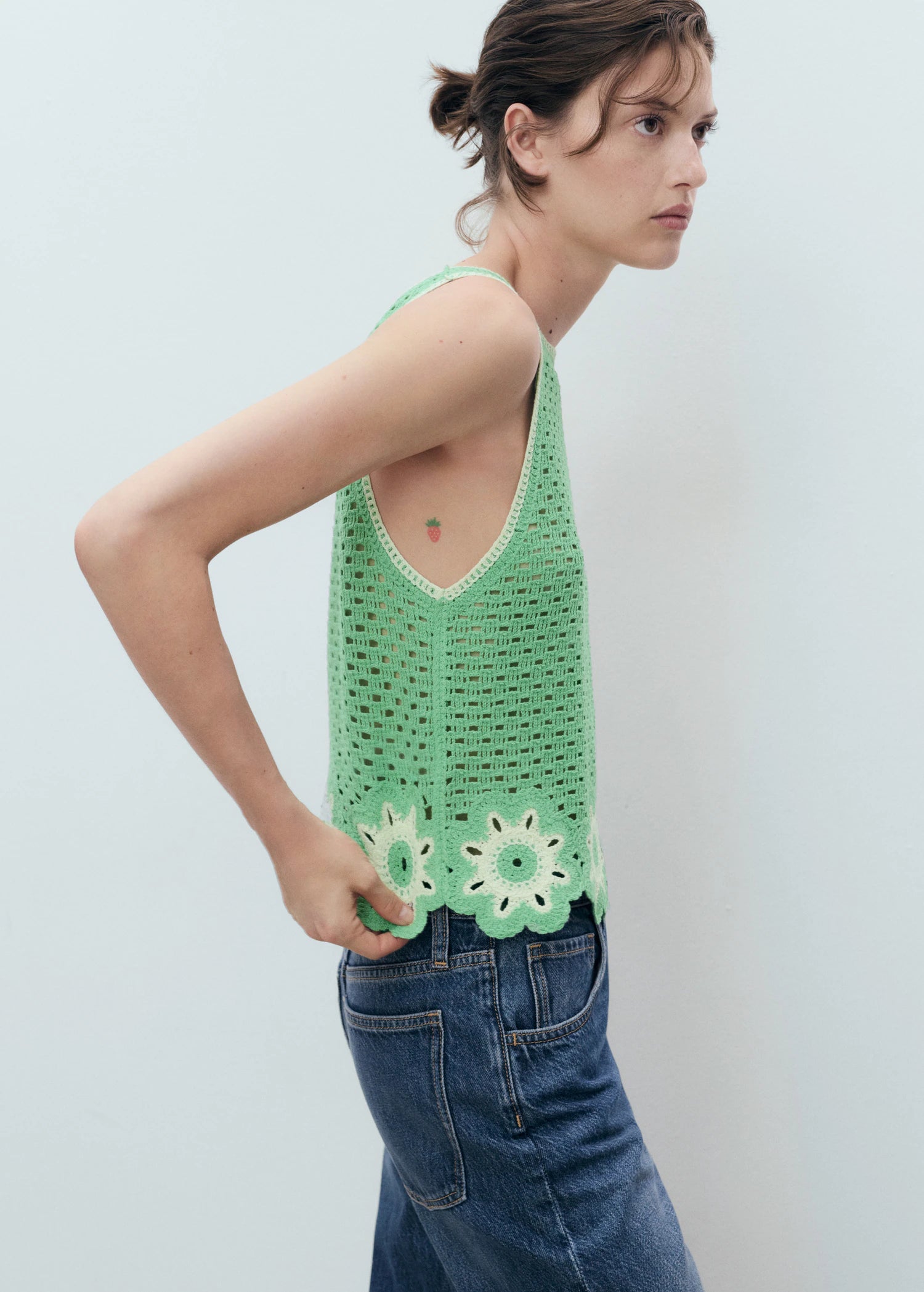 Crochet Top With Floral Finishes