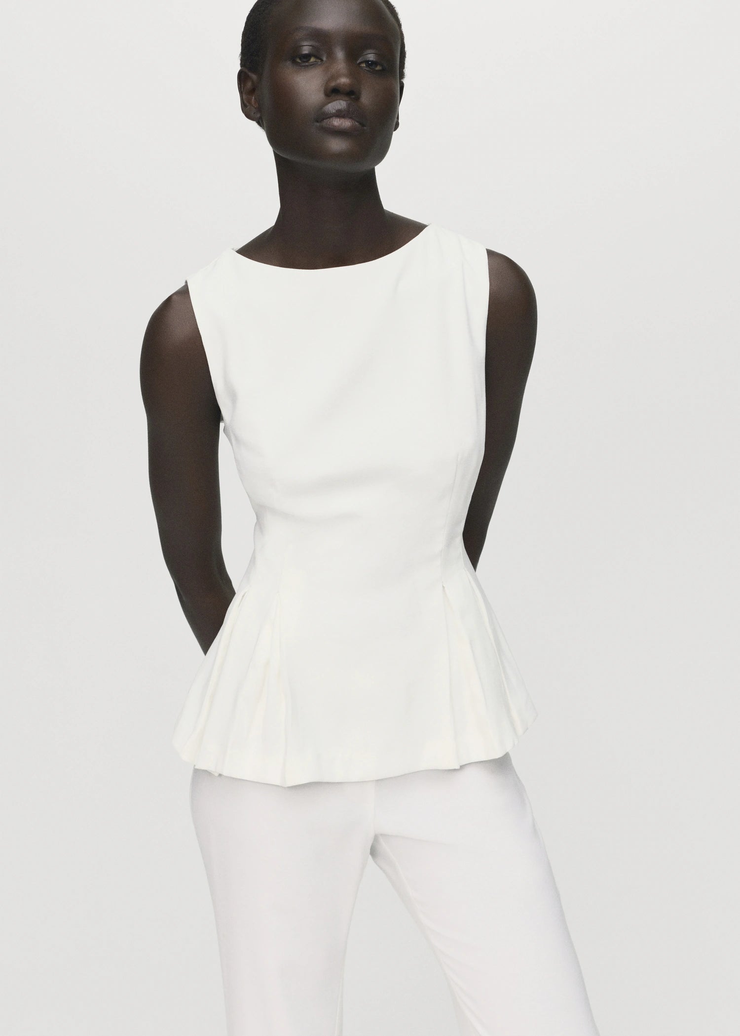 Peplum Top With Pleat Detail