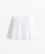 PLEATED COMPRESSIVE SKIRT