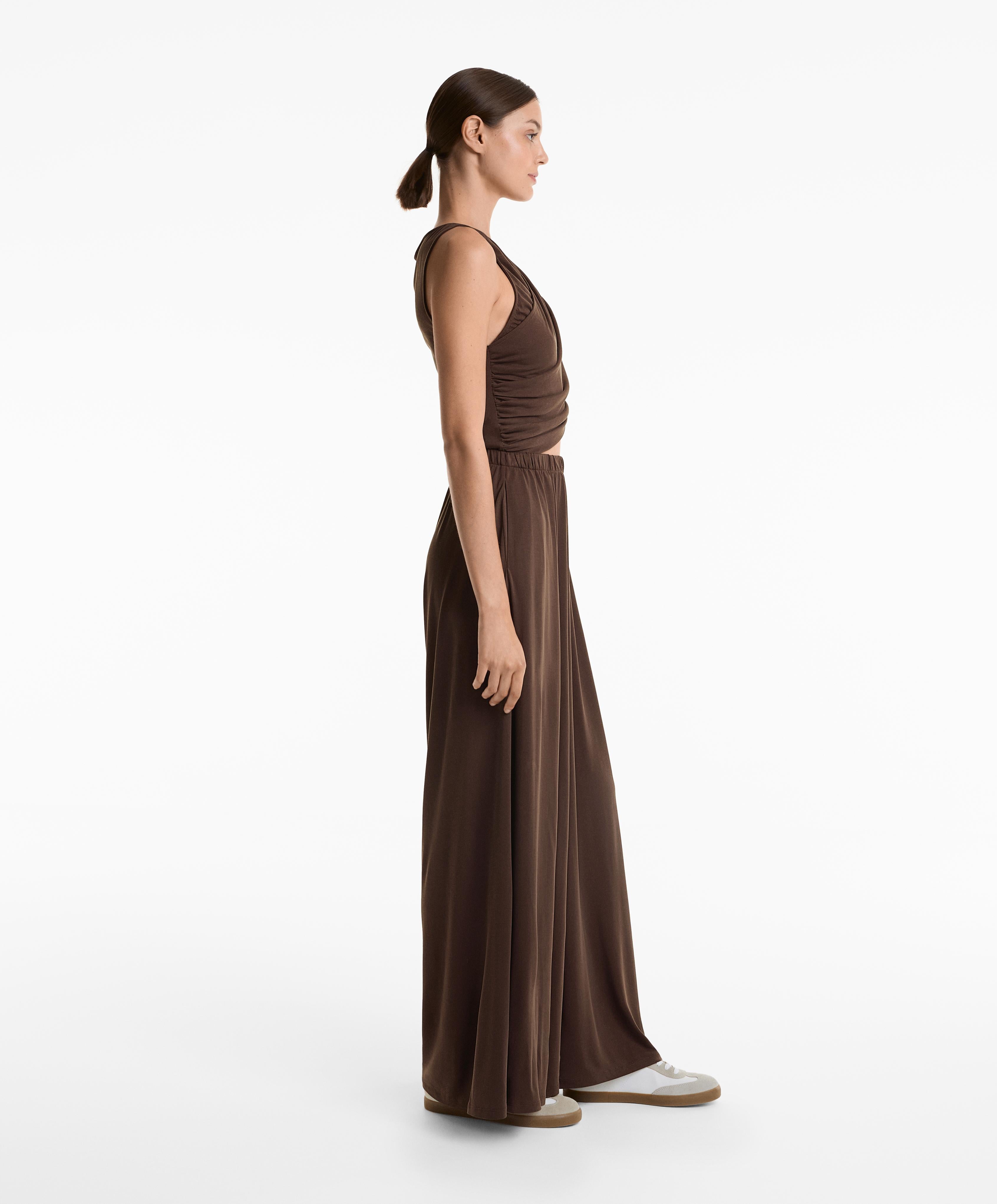 FLOATY CROSSOVER JUMPSUIT WITH MODAL