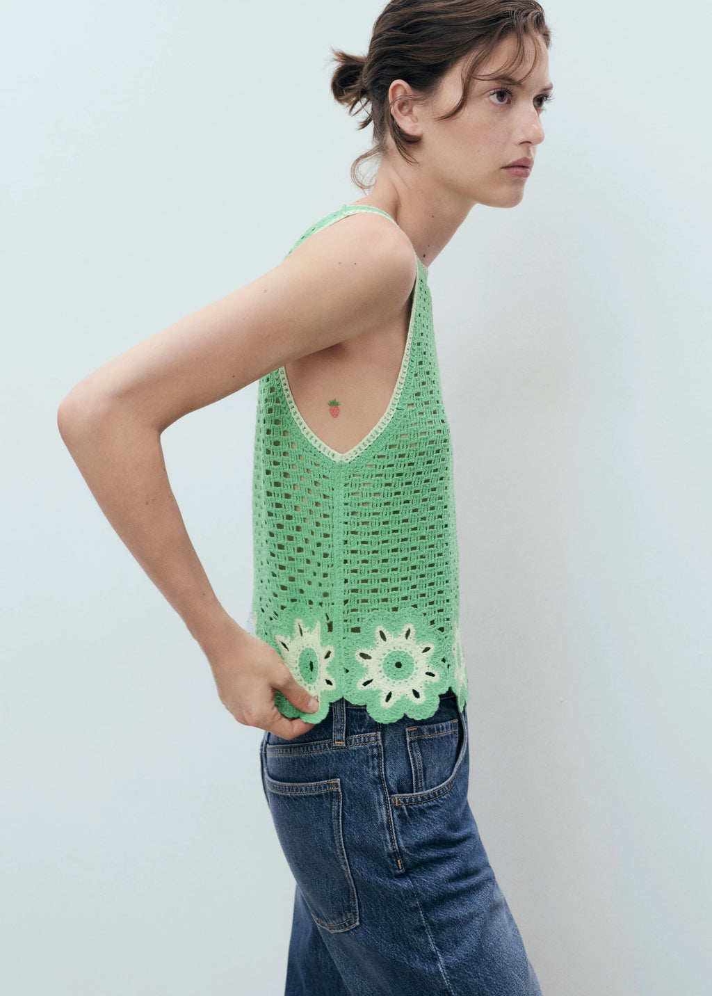 Crochet Top With Floral Finishes