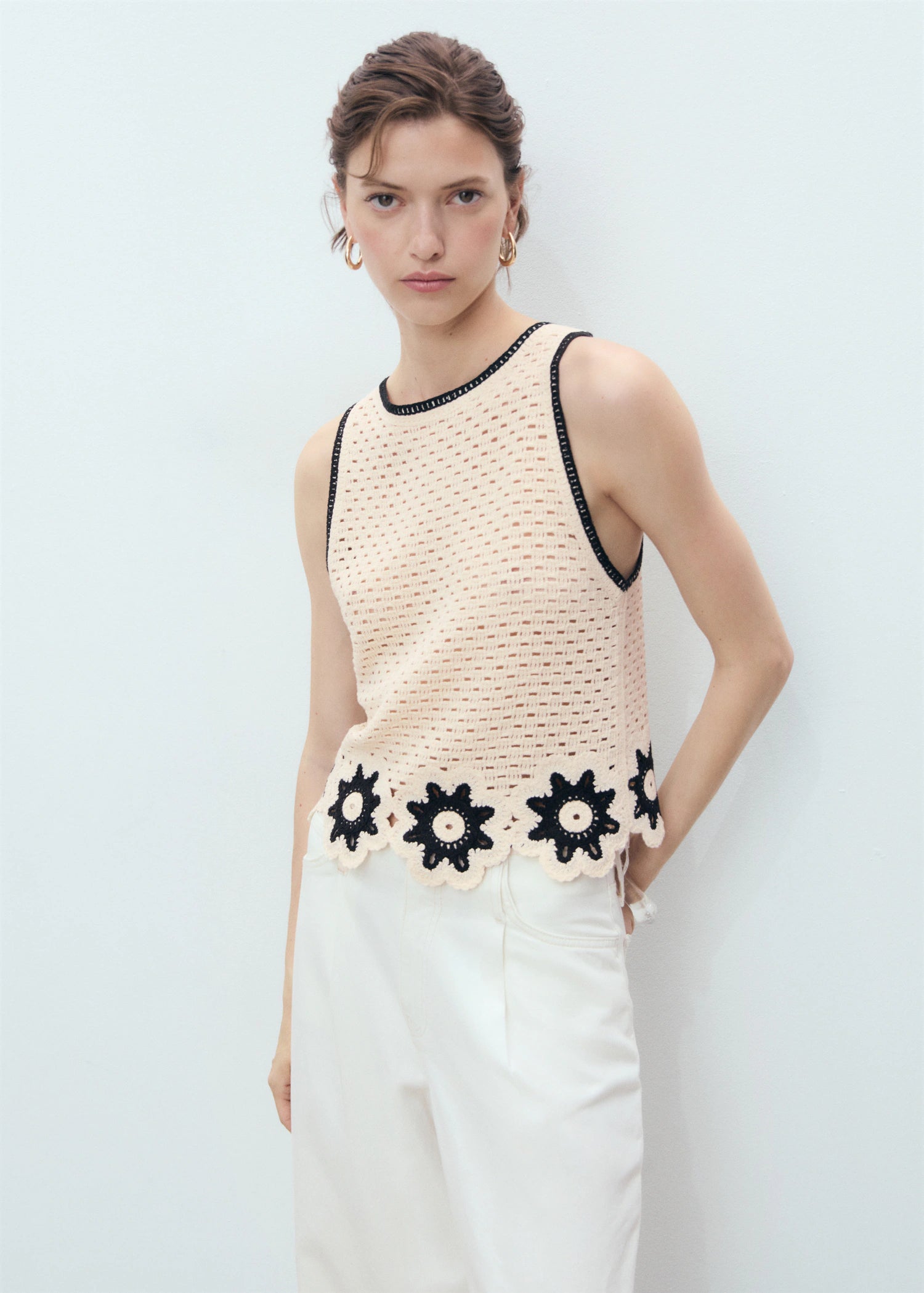 Crochet Top With Floral Finishes