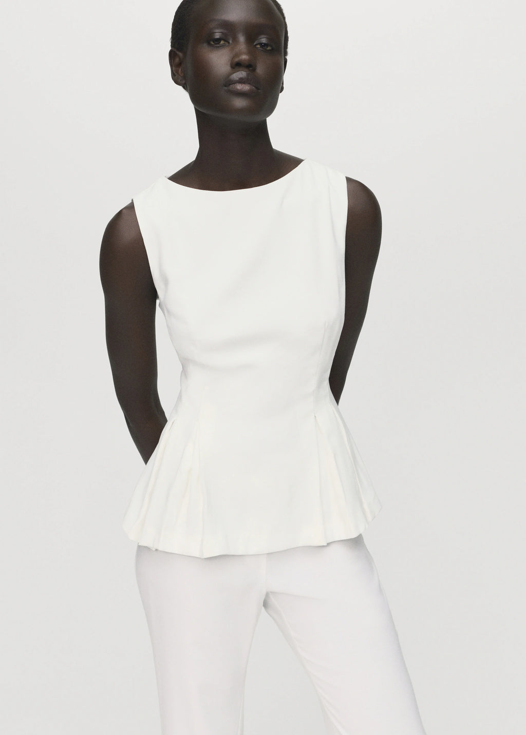 Peplum Top With Pleat Detail