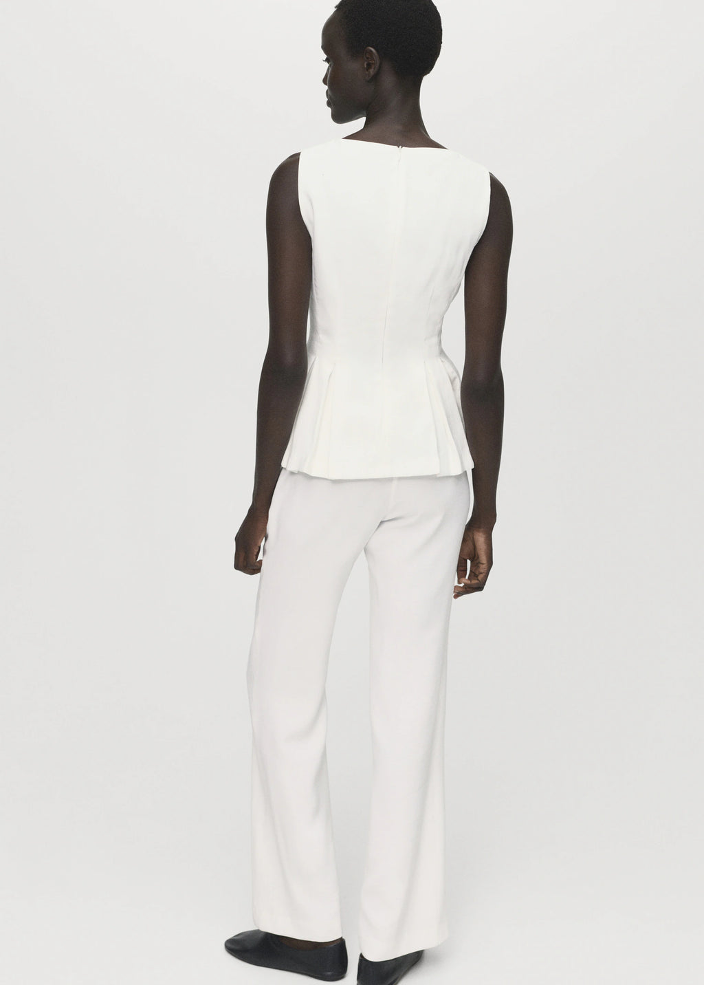 Peplum Top With Pleat Detail