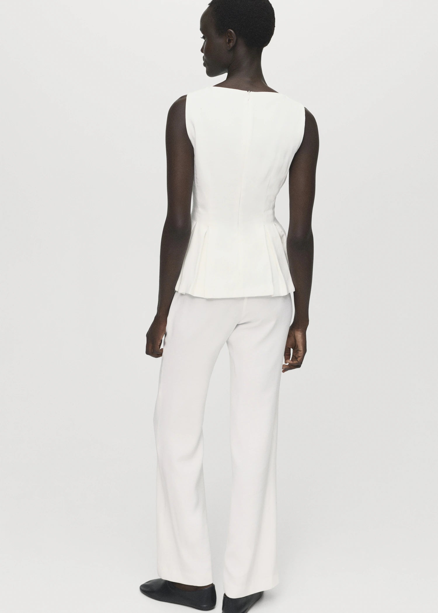 Peplum Top With Pleat Detail