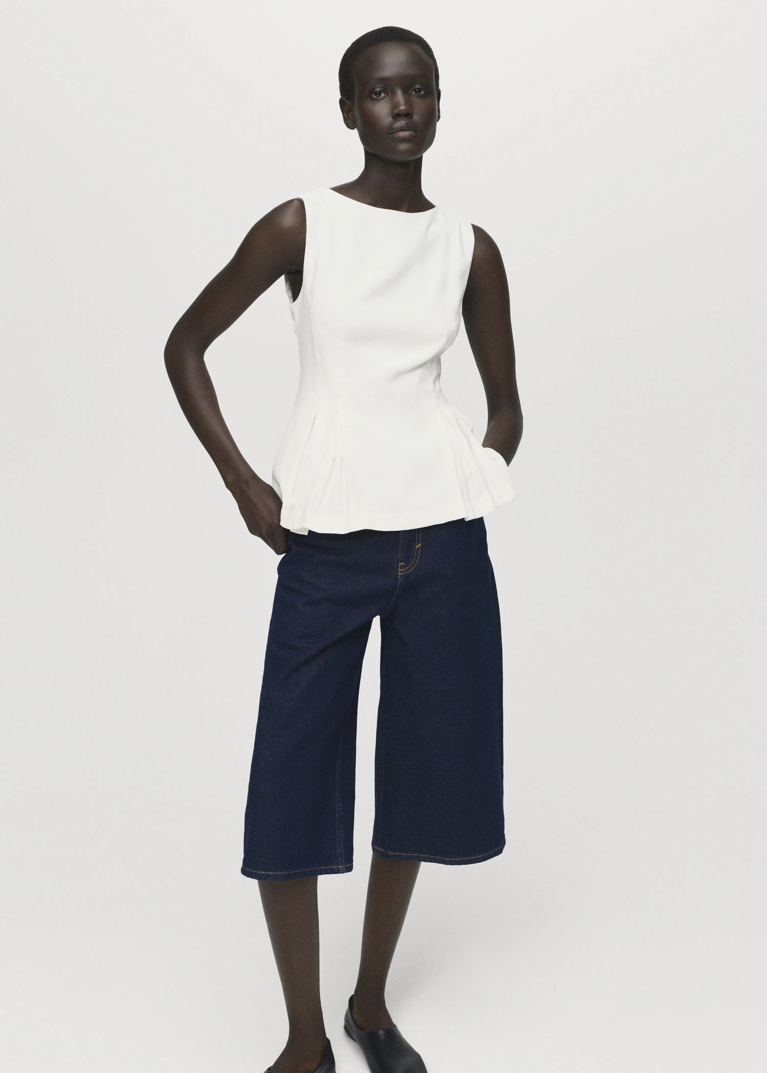 Peplum Top With Pleat Detail